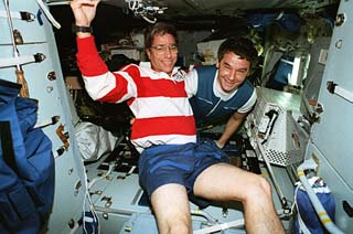 Mission specialist John Blaha (left) and Mir-22 commander Valeri Korzun pose for the camera in the Priroda module. 